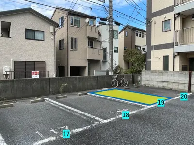 a parking lot with a trampoline in the street at \u30df\u30ce\u30eb\u30d0\u91d1\u753a in Tokyo