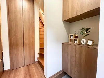 a hallway with wood paneling and stairs in a house at \u30df\u30ce\u30eb\u30d0\u91d1\u753a in Tokyo