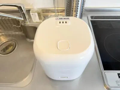a white computer mouse sitting next to a laptop at Tune Inn Residence Nihonbashi in Tokyo