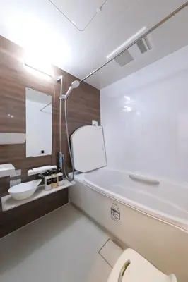 a bathroom with a white toilet and a sink at Akabane Nishi Masuda House in Tokyo