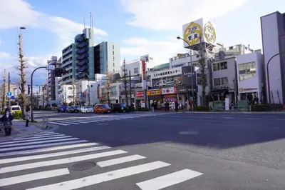 a city street with a crosswalk in a city at Akabane Nishi Masuda House in Tokyo