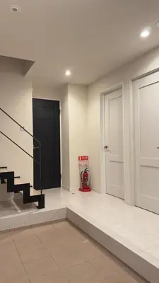a room with a staircase and a door and a fire hydrant at New open! Ikebukuro smart home \u6728\u6728\u65b0\u9928 in Tokyo