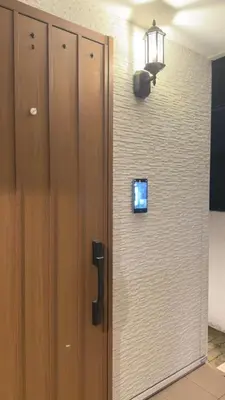 a door with a television on a wall at New open! Ikebukuro smart home \u6728\u6728\u65b0\u9928 in Tokyo