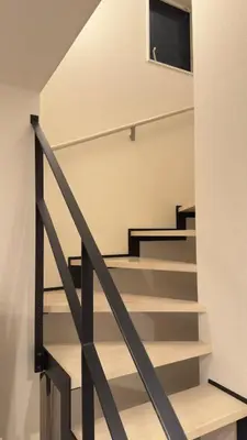 a staircase in a house with a tv on the wall at New open! Ikebukuro smart home \u6728\u6728\u65b0\u9928 in Tokyo