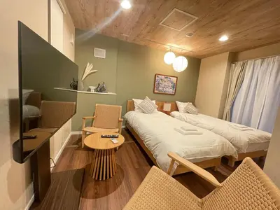 a room with two beds and a table and chairs at OPEN SALE! Stylish Stay near AKIHABARA! May2025 Open! \u79cb\u8449\u539f CORE HOTEL in Tokyo