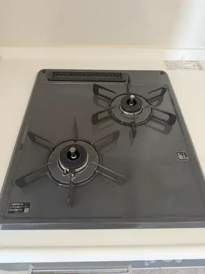 a stove top with two burners on top of it at Walk to JR Shinjuku - Grand Écru II 403 - Balcony & Kitchen in Tokyo
