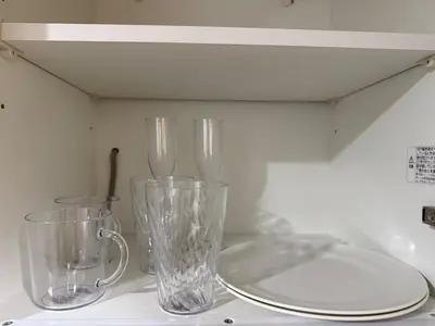 three glass vases sitting on top of a counter at Walk to JR Shinjuku - Grand Écru II 403 - Balcony & Kitchen in Tokyo
