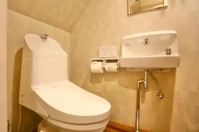 a bathroom with a white toilet and a sink at 201 Modern Ueno House Lucky Yado in Tokyo