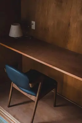 a blue chair sitting under a wooden shelf at 6-minute walk to Tokyo Skytree Up to 6 people 68 sqm fully renovated direct access to Asakusa, Shibuya, Narita Airport, and Haneda Airport in Tokyo