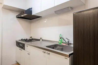 a small kitchen with a sink and a stove at \u304b\u3064\u3089306 in Tokyo