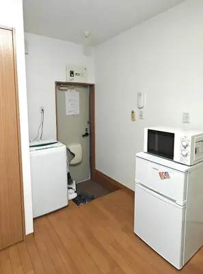 an empty room with two refrigerators and a microwave at Senju 102, Restful Tokyo Studio in Tokyo