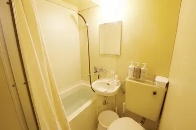 a small bathroom with a toilet and a sink at \u30b9\u30ab\u30a4\u30d4\u30a2\u9ad8\u7802 201 in Tokyo