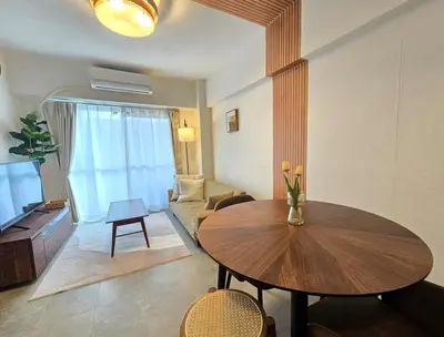 a living room with a table and a couch at MIKASA guesthouse in Tokyo