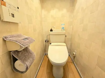a small bathroom with a toilet and a sink at MIKASA guesthouse in Tokyo