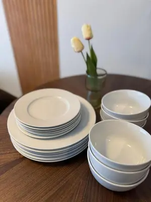 a group of plates and bowls sitting on a table at MIKASA guesthouse in Tokyo