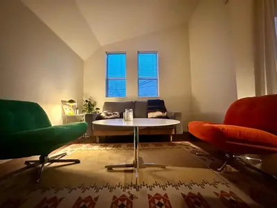 a living room with two chairs and a table at Tokyo Designer Guest House in central Tokyo in Tokyo
