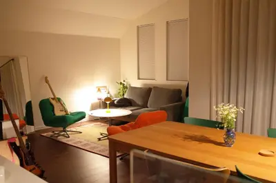 a living room with a couch and a table at Tokyo Designer Guest House in central Tokyo in Tokyo