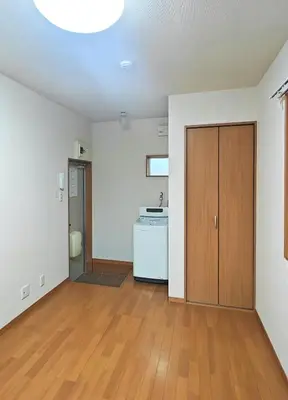 an empty room with a door and a kitchen at Senju 103, Relaxed Tokyo Studio in Tokyo