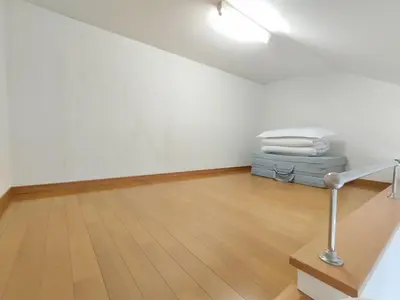 a room with a table and a pile of towels at Senju 201, Cozy Tokyo Loft in Tokyo