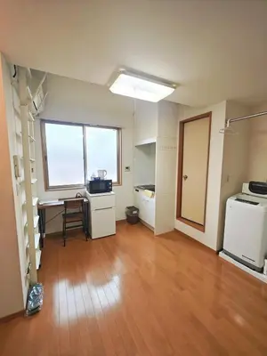 an empty room with a desk and a table in a room at Senju 201, Cozy Tokyo Loft in Tokyo