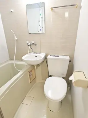 a small bathroom with a toilet and a sink at Senju 201, Cozy Tokyo Loft in Tokyo
