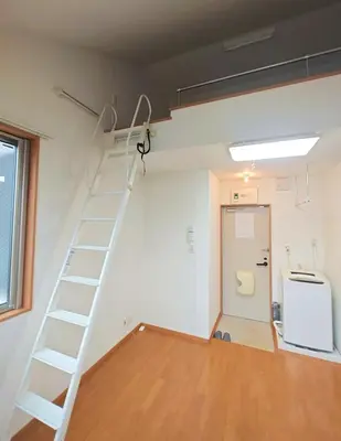 a room with a ladder in a room with a door at Senju 202, Restful Tokyo Loft in Tokyo