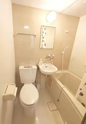 a bathroom with a toilet and a sink and a tub at Senju 202, Restful Tokyo Loft in Tokyo