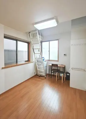 a room with a ladder and a table in it at Senju 203, Relaxed Tokyo Loft in Tokyo