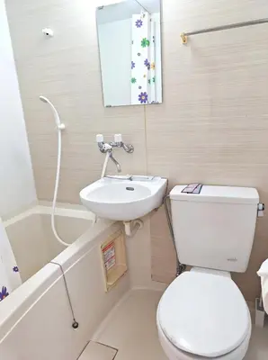 a bathroom with a white toilet and a sink at Senju 203, Relaxed Tokyo Loft in Tokyo