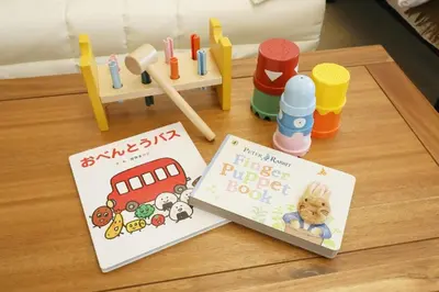 a table with a book and some toys on it at \u5bdb\u6c38\u5bfa\u5742\u30cf\u30a4\u30e0 501 in Tokyo