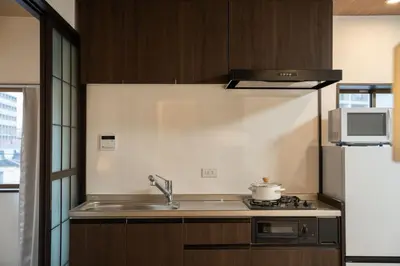 a kitchen with a sink and a stove and a refrigerator at 大田Nishikōjiya hotel-OT0368 in Tokyo