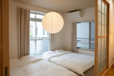 a bedroom with two beds in front of a window at 大田Nishikōjiya hotel-OT0368 in Tokyo