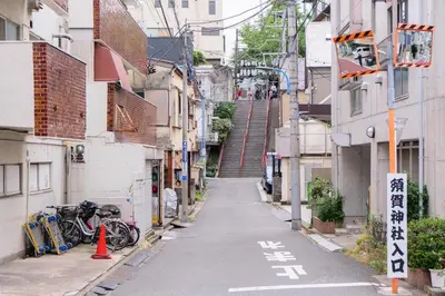 an alley with bikes parked on the side of buildings at Mi-HOTEL MIYA SHINJUKU in Tokyo