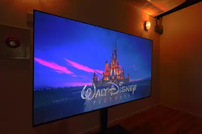 a flat screen tv with a walt disney logo on it at Steps from Shibuya Crossing Roof Top A in Tokyo