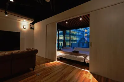 a bedroom with a bed and a large window at Steps from Shibuya Crossing Roof Top A in Tokyo