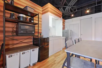 a kitchen and dining room with a table and a tv at Steps from Shibuya Crossing Roof Top A in Tokyo