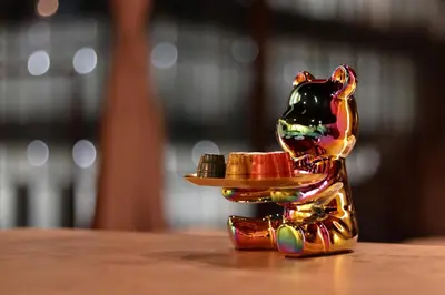 a figurine of a cat with a hat on a table at Steps from Shibuya Crossing Roof Top A in Tokyo