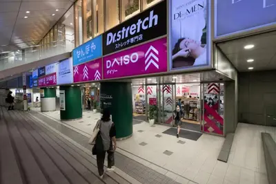 a woman walking inside of a shopping mall at Stay in the heart of Shibuya in Tokyo