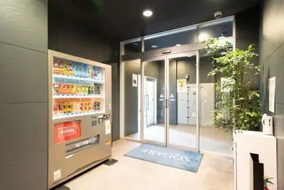 a store entrance with a drink machine in a store at Stay in the heart of Shibuya in Tokyo