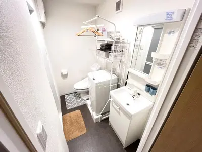 a small bathroom with a toilet and a sink at \u6c60\u888b \u5de3\u9d28 YMhotel \u6700\u592718\u540d\u53ef-ikebukuro sugamo- in Tokyo