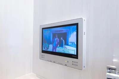 a flat screen tv hanging on a wall at LIVCITY Kinshicho 301 in Tokyo