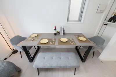 a dining room table with two chairs and a table and chairsuggest at LIVCITY Kinshicho 501 in Tokyo