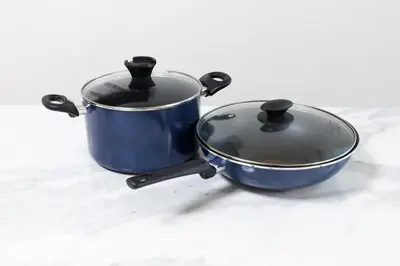 a blue pot and a pan sitting on a table at 3 bedrooms, 5-minute walk to Shinjuku City Center, Isetan department store , max 7 people in Tokyo