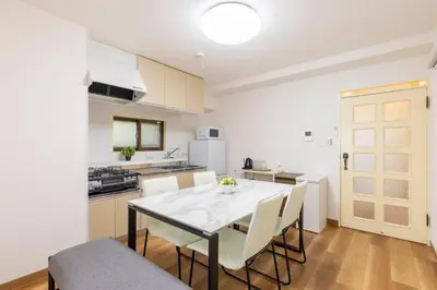 a kitchen and dining room with a table and chairs at 3 bedrooms, 5-minute walk to Shinjuku City Center, Isetan department store , max 7 people in Tokyo