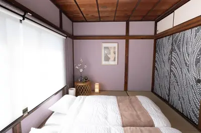 a bedroom with a bed and a large window at Max 15 people OK,2-minute walk from the station, Japanese-style modern 6LDK house in Tokyo