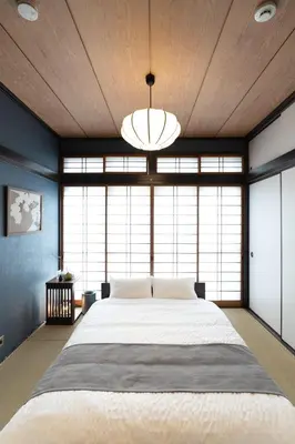 a bedroom with a large bed and a large window at Max 15 people OK,2-minute walk from the station, Japanese-style modern 6LDK house in Tokyo