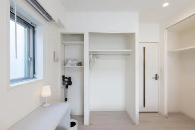 a white room with a door and a window at LIVCITY Kinshicho 601 in Tokyo