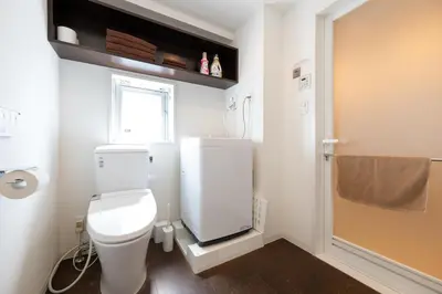 a small bathroom with a toilet and a window at LIVCITY Kinshicho 601 in Tokyo