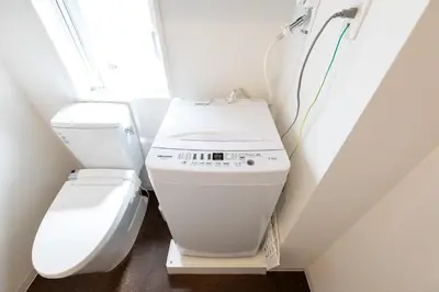 a small bathroom with a toilet and a window at LIVCITY Kinshicho 601 in Tokyo
