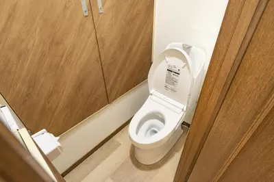 a bathroom with a toilet with the lid up at 2BR Apartment Only 2 Stops to Shinjuku Includes Baby Essentials & Luggage Hold in Tokyo